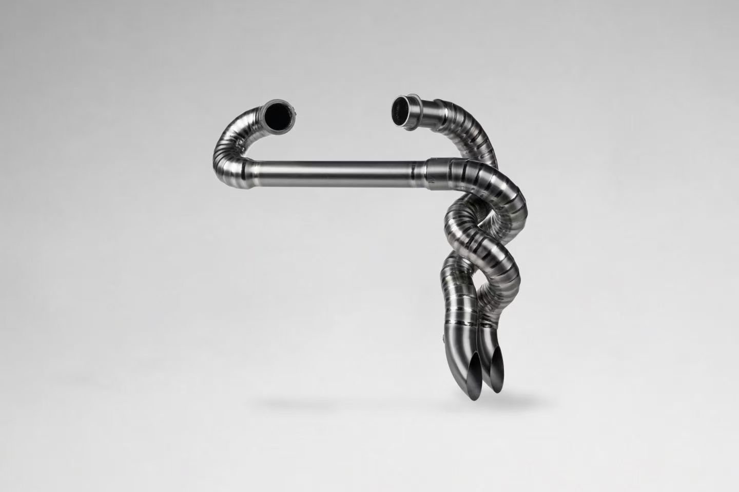 Abstract sculpture with twisted metallic pipes