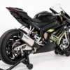 Black sport motorcycle on a stand.