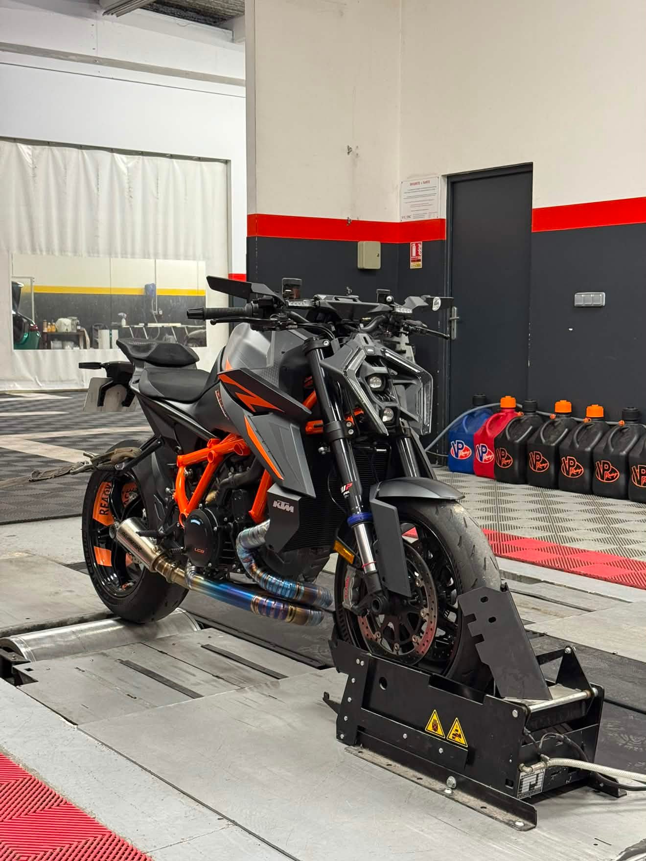 KTM motorcycle on a workshop maintenance stand