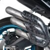 Close-up of motorcycle exhaust pipes and wheel.