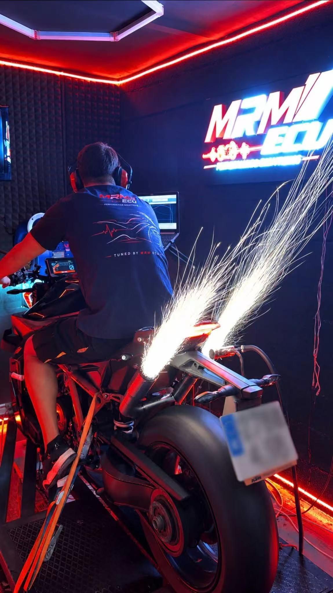 Motorcycle on a dyno emitting sparks